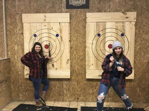 Tagtime Laser Tag's new axe throwing lanes.The Ladies are showing how its done with a perfect axe throw at Tagtime Laser Tag
